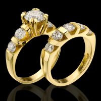 Tension Set Large Diamond Curved 8 Prong Engagement Ring and Matching Wedding Band